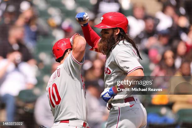 Brandon Marsh of the Philadelphia Phillies celebrates a solo home run with J.T. Realmuto during the second inning against the Chicago White Sox at...