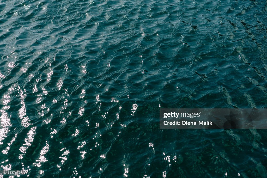 Blue lake water with waves background