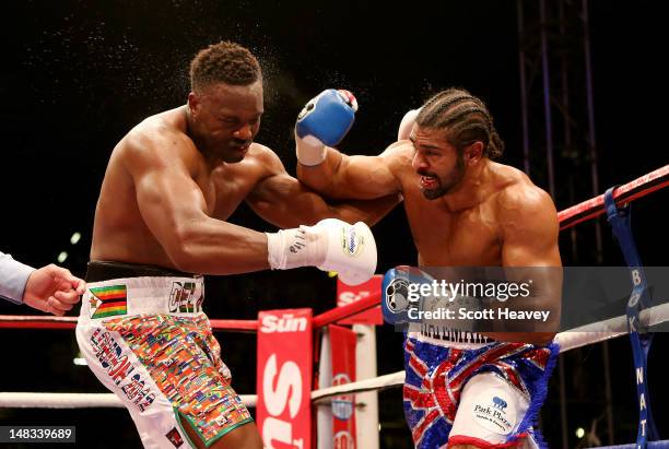 David Haye in action with Dereck Chisora during their vacant WBO and WBA International Heavyweight Championship bout on July 14, 2012 in London,...