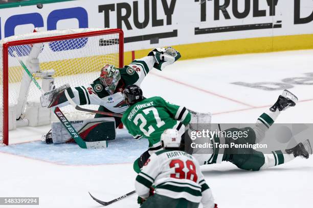 Filip Gustavsson of the Minnesota Wild blocks a shot on goal against Mason Marchment of the Dallas Stars in the second overtime period in Game One of...