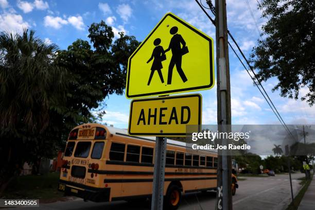 School crossing sign warns drivers in front of an elementary school on April 19, 2023 in Miami, Florida. The Florida Board of Education today...
