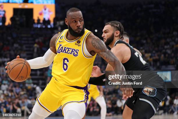 LeBron James of the Los Angeles Lakers handles the ball during the first half against David Roddy of the Memphis Grizzlies during Game Two of the...