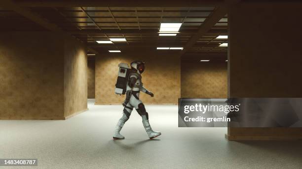 abstract image of astronaut walking in old derelict offices - walking past office wall stock pictures, royalty-free photos & images