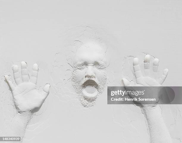 relief of hands and face - stuck stock pictures, royalty-free photos & images
