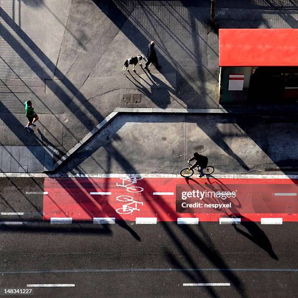 long shadows - fahrradweg stock-fotos und bilder