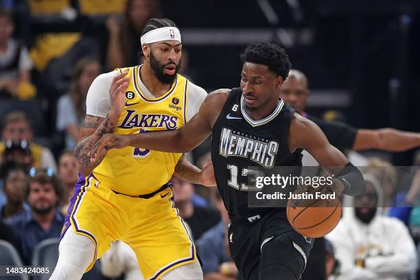 Jaren Jackson Jr. #13 of the Memphis Grizzlies handles the ball against Anthony Davis of the Los Angeles Lakers during the first half of Game Two of...