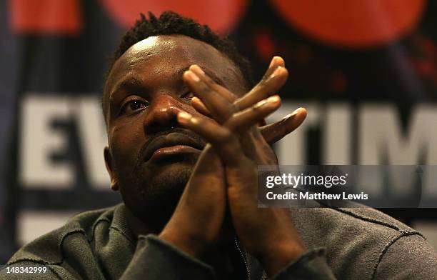 Dereck Chisora looks on, during a press conference after the Heavyweight Fight against David Haye at Boleyn Ground on July 14, 2012 in London,...