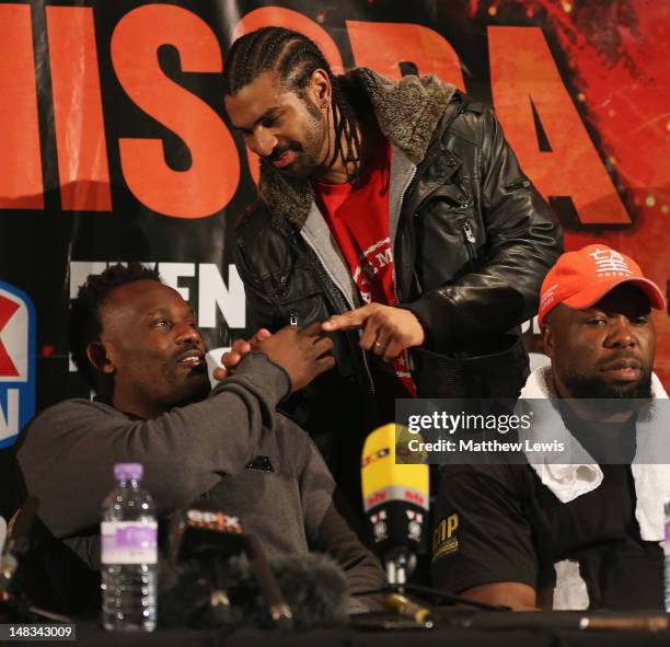 Dereck Chisora and David Haye shake hands during a press conference after the Heavyweight Fight at Boleyn Ground on July 14, 2012 in London, England.