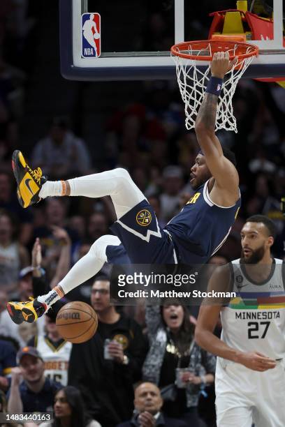 Bruce Brown of the Denver Nuggets dunks against Rudy Gobert of the Minnesota Timberwolves in the first quarter during Round 1 Game 2 of the NBA...