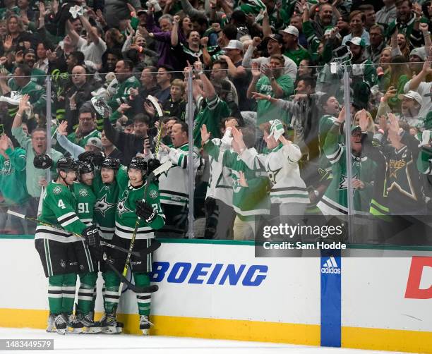 Roope Hintz of the Dallas Stars celebrates with Miro Heiskanen, Tyler Seguin, and Jason Robertson after scoring a goal during the second period...