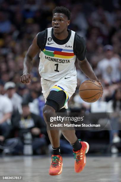 Anthony Edwards of the Minnesota Timberwolves brings the ball down the court against the Denver Nuggets in the first quarter during Round 1 Game 2 of...