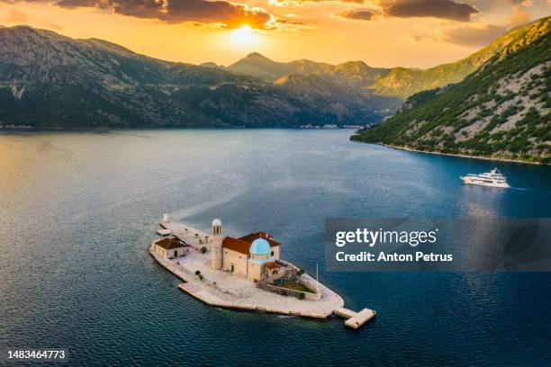 aerial view of our lady of the rock and st. george island on shore of boka kotor bay, montenegro. - montenegro photos et images de collection