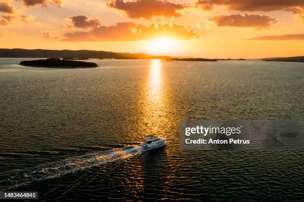 luxury motor yacht at sunset, aerial view. vacation at sea - mediterranean climate stock pictures, royalty-free photos & images
