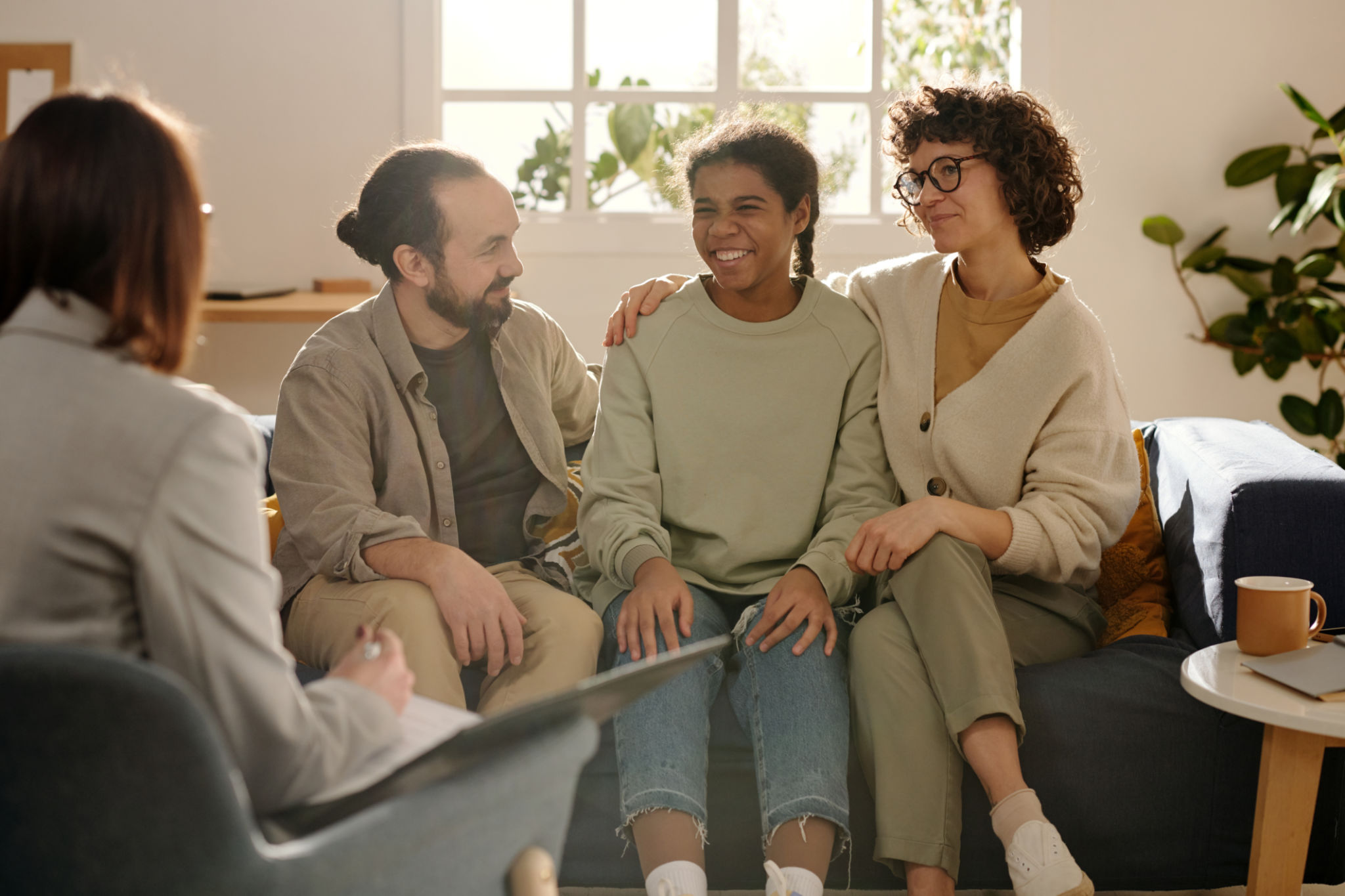 Foster parents talking to social worker Foster parents talking to social worker