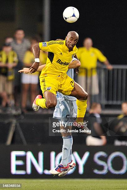 Emilio Renteria of the Columbus Crew gains control of the ball in front of Matt Besler of Sporting Kansas City on July 14, 2012 at Crew Stadium in...