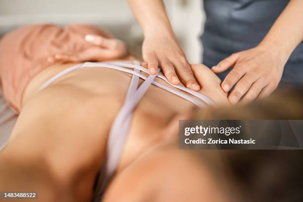 physiotherapy for the neck pain - shoulder massage stock pictures, royalty-free photos & images