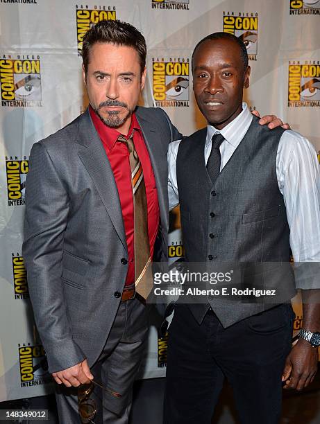 Actors Robert Downey Jr. And Don Cheadle arrive at the "Iron Man 3" panel with Marvel Studios during Comic-Con International 2012 at San Diego...