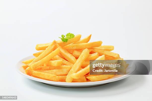 plate of delicious looking french fries - french fries stock pictures, royalty-free photos & images