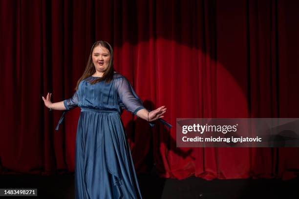 young woman with down syndrome acting in the theatre - cantor de ópera imagens e fotografias de stock