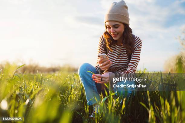 young woman in wheat field - april 22 stock pictures, royalty-free photos & images