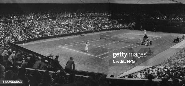 Suzanne Lenglen , left, and Elizabeth "Bunny" Ryan on centre court during the second round of the Women's singles tennis tournament at the Wimbledon...