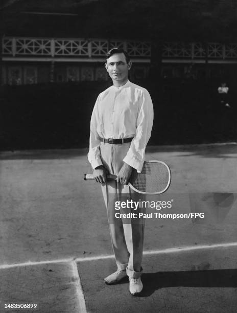 Tennis player Conrad H Young holding his tennis racket, circa 1909. Photo by Paul Thompson/FPG/Archive Photos/Getty Images)