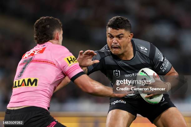 Latrell Mitchell of the Rabbitohs is tackled during the round eight NRL match between South Sydney Rabbitohs and Penrith Panthers at Accor Stadium on...