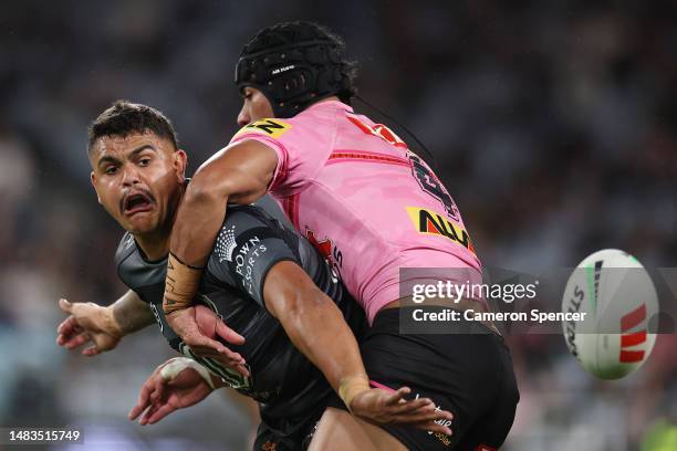 Latrell Mitchell of the Rabbitohs is tackled by Stephen Crichton of the Panthers during the round eight NRL match between South Sydney Rabbitohs and...