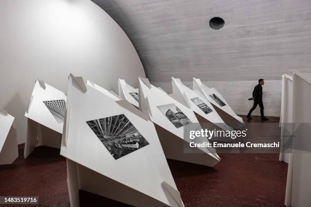 Man visits a design exhibition dedicated to Italian architect Arrigo Arrighetti part of Dropcity, a new centre for Architecture and Design, at...