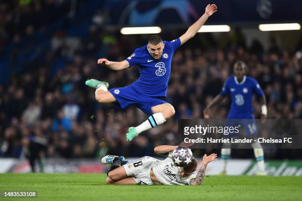 Enzo Fernandez of Chelsea is challenged by Toni Kroos of Real Madrid during the UEFA Champions League quarterfinal second leg match between Chelsea...