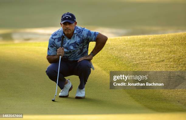 Jonathan Byrd of the United States lines up a putt on the 10th green during the first round of the Zurich Classic of New Orleans at TPC Louisiana on...