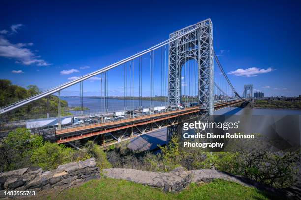 view of the george washington bridge and inbound traffic on the upper level from the fort lee historic park in fort lee, new jersey - george washington bridge fotografías e imágenes de stock