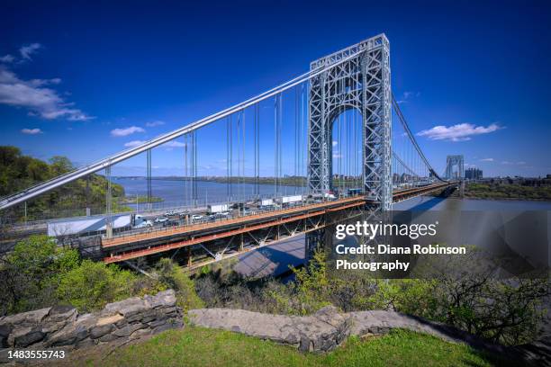 view of the george washington bridge and inbound traffic on the upper level from the fort lee historic park in fort lee, new jersey - george washington bridge stock pictures, royalty-free photos & images