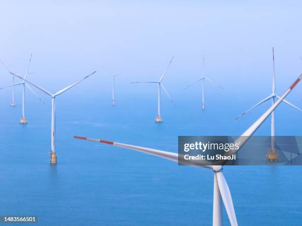 offshore wind farm in the sea. - power station stock pictures, royalty-free photos & images