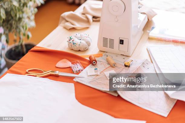 office for small sewing business with table and sewing machine - sewing machine imagens e fotografias de stock