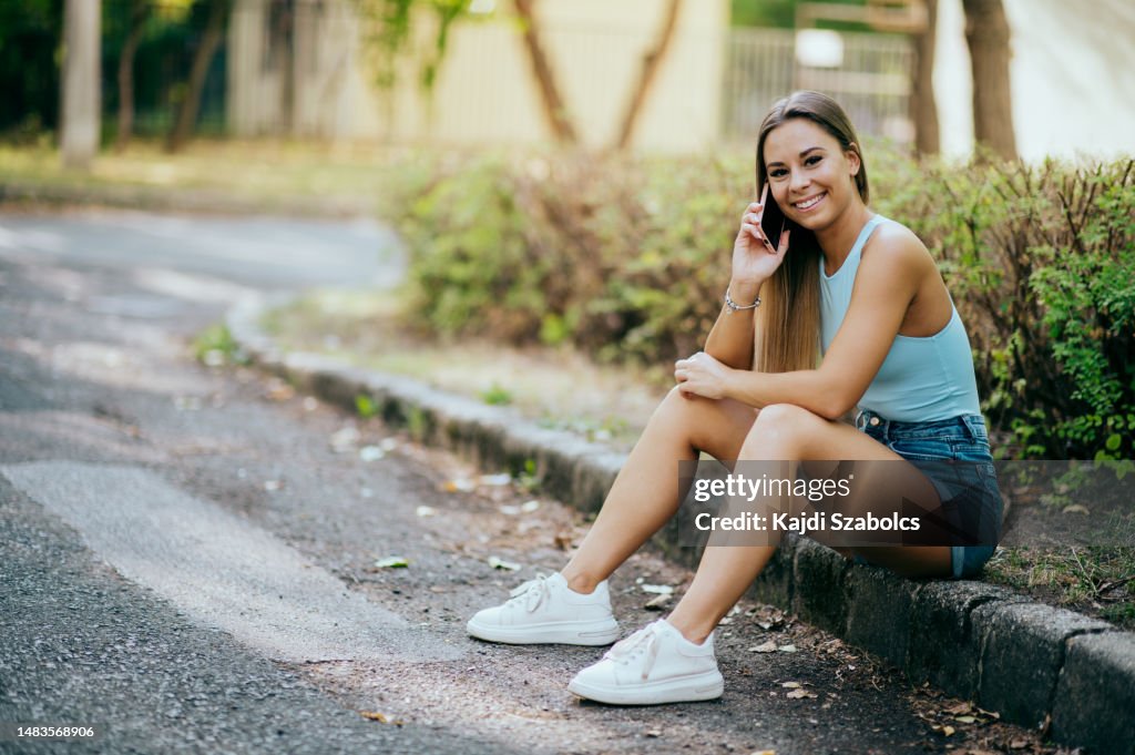 Young Adult Women Using Smart Phone In City High-Res Stock Photo ...