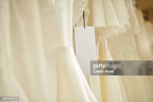 blank label on wedding dress - bridal shop stock pictures, royalty-free photos & images