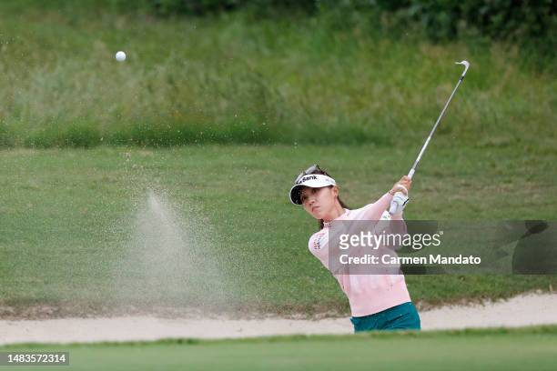 Lydia Ko of New Zealand plays a shot from a bunker on the tenth hole during the first round of The Chevron Championship at The Club at Carlton Woods...