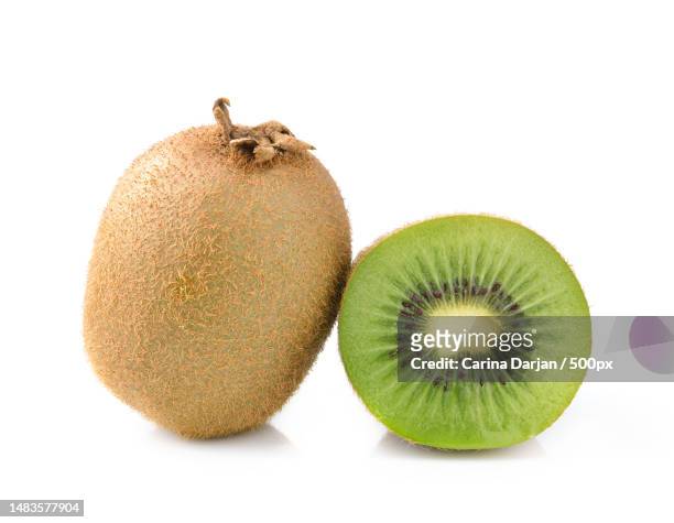 kiwi fruit isolated on white background - kiwi foto e immagini stock