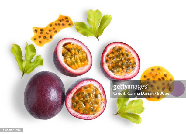 passion fruit with leaf on white background top view - maracuja stock-fotos und bilder