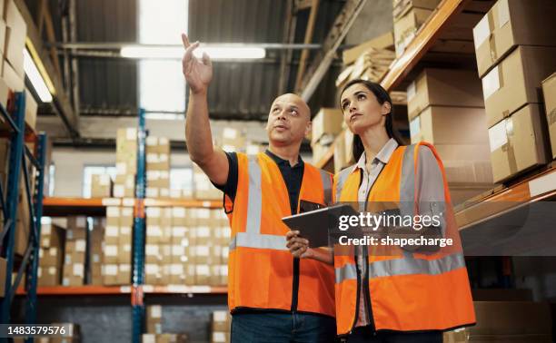warehouse, inspection and people manager with tablet stock inventory, storage boxes or factory engineer planning. woman training for package management on e commerce software, logistics and business - female factory stockfoto's en -beelden