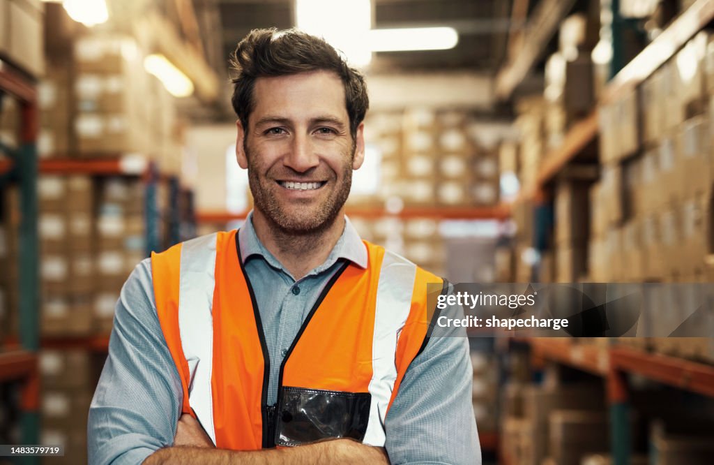 Warehouse worker, smile and portrait of man with arms crossed with pride for career or logistics job. Face, engineer and happiness, proud and confident supply chain employee or person from Canada.