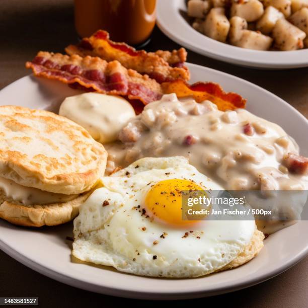 dandy krampus breakfast plate fried eggs bacon biscuits and grav,united states,usa - krampus stock pictures, royalty-free photos & images
