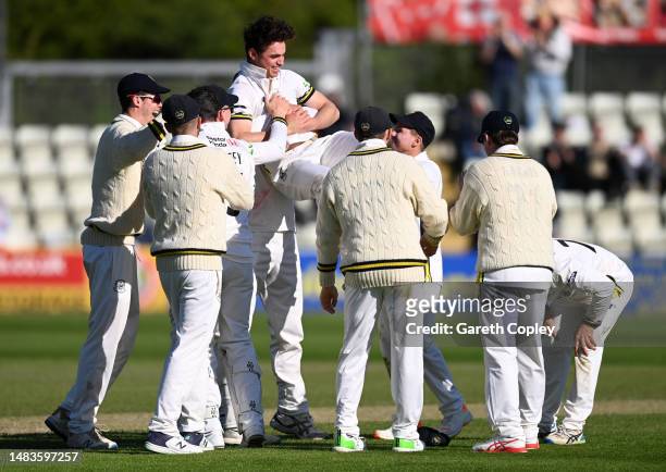Tom Price of Gloucestershire celebrates with teammates after dismissing Brett D'Oliveira of Worcestershire to complete his during the LV= Insurance...