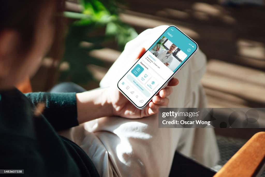 Young woman having a virtual medical appointment via smartphone