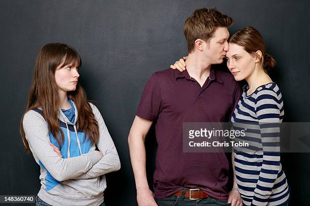 woman angry at couple in love - love hate stock-fotos und bilder