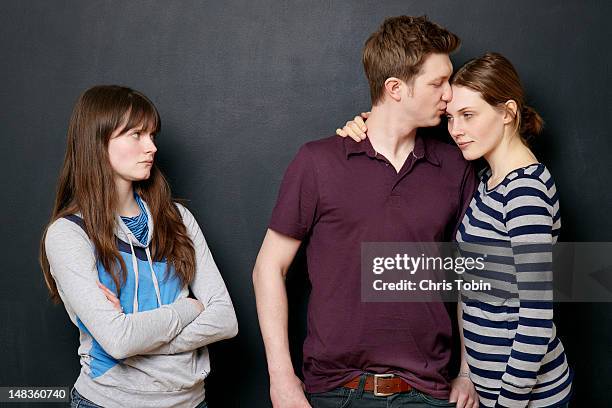 woman angry at couple in love - jealousy stockfoto's en -beelden