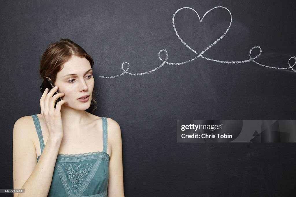 Young woman talking on the telephone