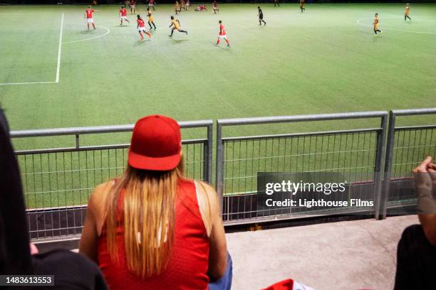 fans watch from the stadium bleachers in anticipation during an international soccer match - championship round one fotografías e imágenes de stock