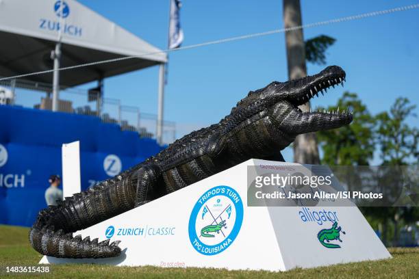 Sculpture of Tripod the Alligator is displayed near the 18th fairway during Round One of the Zurich Classic of New Orleans at TPC Louisiana at TPC...